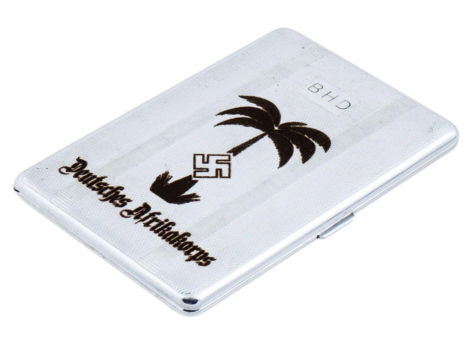 WWII NAZI GERMAN AFRIKAKORPS CIGARETTE CASE: A WWII Nazi German cigarette case, etched with a repeated pattern and a Palm with a swastika and inscribed: Deutsches Afrikakorps on the lid. Marked, Sylva Chrome, Made in England, under the lid. Seco