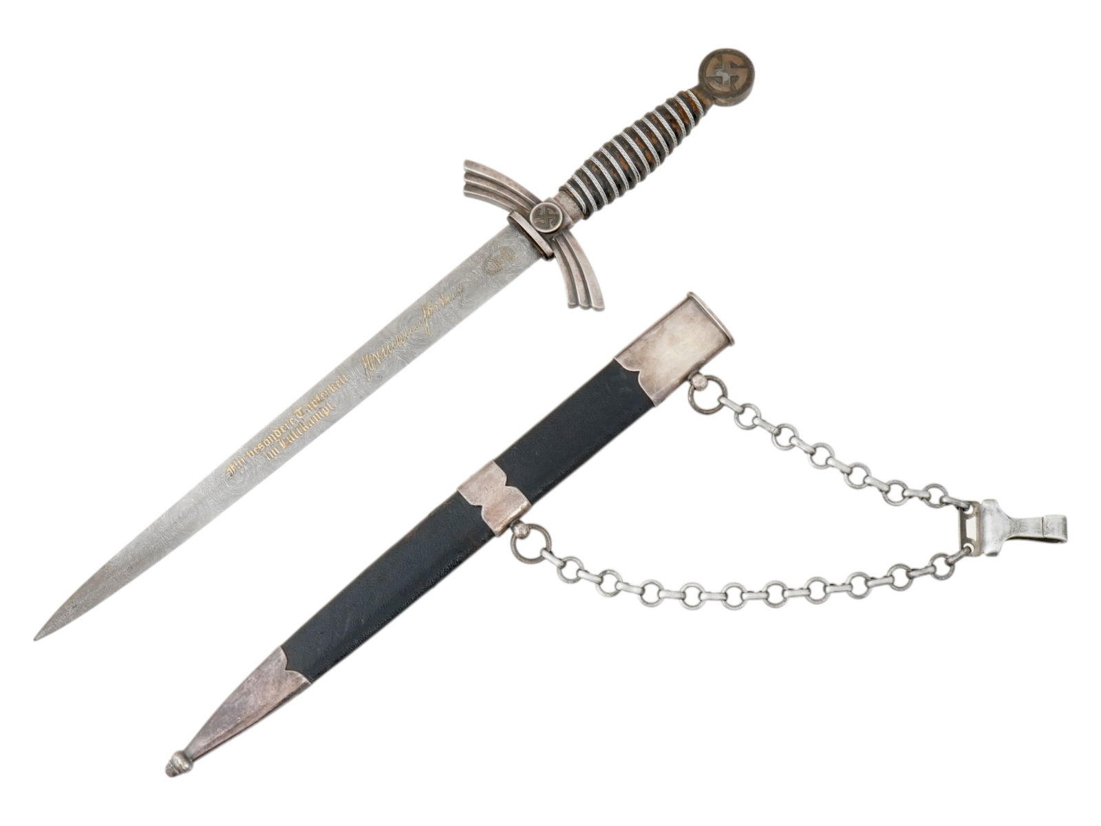 WWII NAZI GERMAN LUFTWAFFE OFFICERS PRESENTATION DAGGER: A WWII Nazi German Luftwaffe officers presentation dagger featuring a Damascus stainless steel, straight, double edged pointed blade. The blade has a gilt engraved inscription in German: Für besonder