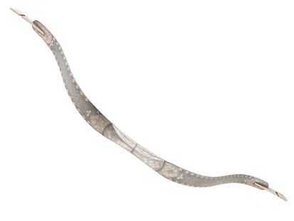 ANTIQUE PERSIAN DAMASCUS STEEL BOW W SILVER INLAY: An extremely fine antique Persian damascened steel bow. Qajar Empire, 19th century. Inlaid with fine silver Koftgari decoration. Total Weight: 1070 grams. Collectible Arms And Cold Weapons, Islamic Me