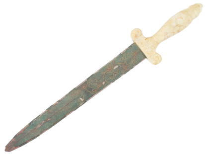 VINTAGE CHINESE DAGGER WITH CARVED WHITE JADE HANDLE: A vintage Chinese dagger featuring a carved white jade handle and an ornate blade with inlaid decorative motifs. The blade showcases intricate detailing, possibly of symbolic or auspicious design, whi