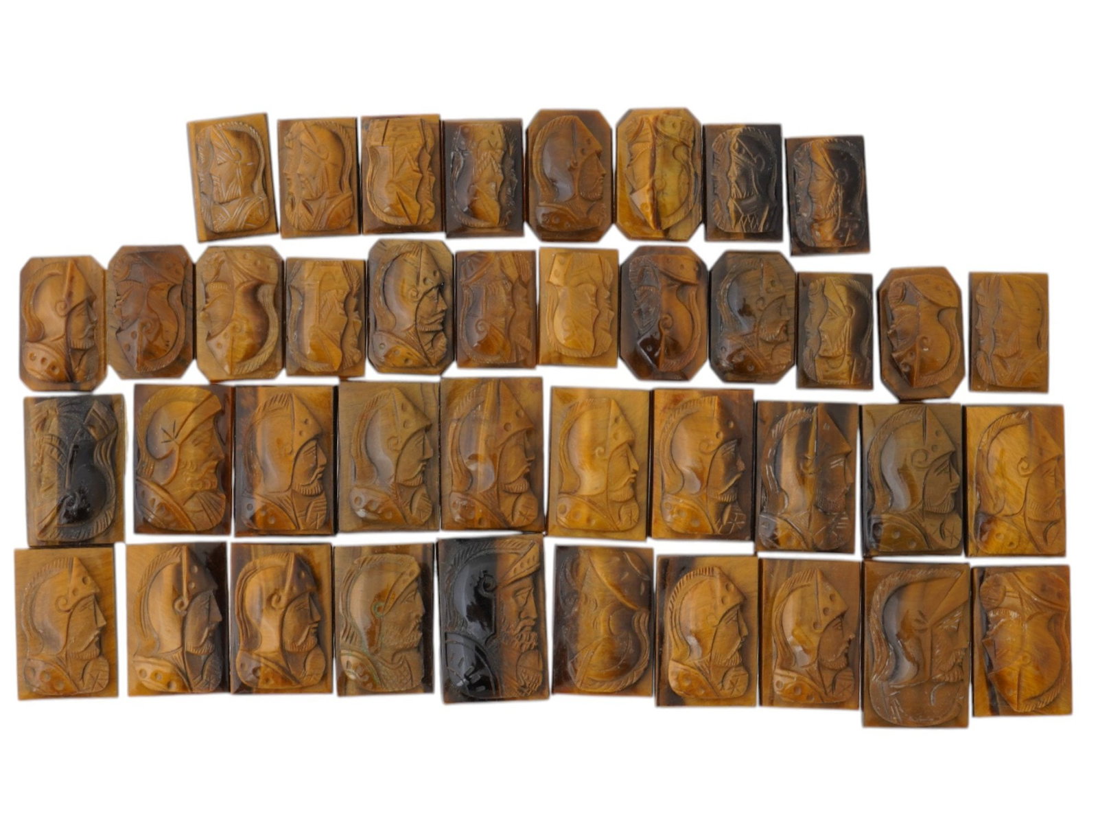 LOT OF WARRIOR PORTRAIT CARVED TIGER EYE CAMEOS: A collection of vintage cameos in various shapes. Each cameo with a rectangular or octagonal carved Tiger eye panel with relief portrait of a Roman warrior in profile. Vintage Jewelry And Accessories,