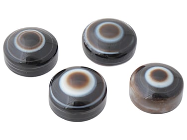 COLLECTION OF TIBETAN CARVED SHEEP EYE DZI BEADS
