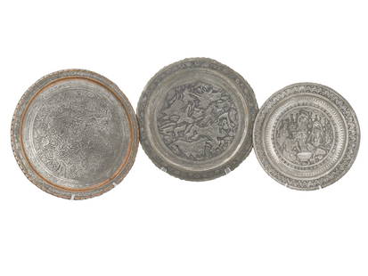EASTERN EUROPEAN CIRCULAR COPPER SILVER PLATED TRAYS: A lot of three Eastern European circular copper trays, presumably silver plated. Each tray features intricate embossed designs depicting different scenes. Metalwork Antiques And Collectibles, Islamic