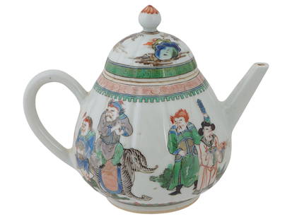 CHINESE FAMILLE VERTE ENAMELED PORCELAIN TEA POT: A Chinese Famille Verte hand painted porcelain tea pot. The exterior of the ware is adorned with a hand painted design representing a campaign genre scene. The base and the neck are decorated with sca