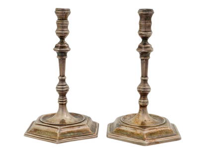 PAIR OF MINIATURE ENGLISH SHEFFIELD SILVER CANDLESTICKS: A pair of miniature English Sheffield silver candlesticks. Figural candlesticks with a ribbed surface and a wide stepped base. Traces of English Sheffield silver hallmarks on the bottom of each. Colle