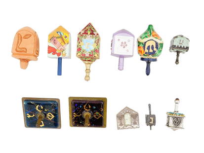 COLLECTION OF JUDAICA ENAMEL HANUKKAH DREIDELS: A collection of assorted American and Israeli Hanukkah dreidels. The dreidels are made in various designs featuring enamel Hebrew, floral, foliage, foliate scroll, scene ornaments. Several are marked