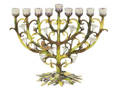 ART NOUVEAU ISRAELI ENAMEL BRASS HANUKKAH MENORAH LAMP: An Art Nouveau manner Israeli nine branched enamel brass Hanukkah Menorah lamp. The lamp is made in a tree branch design with foliate scroll accents, decorated with flowers and butterflies, encrusted
