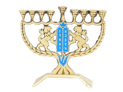 MID CEN JUDAICA ISRAELI ENAMEL BRASS HANUKKAH LAMP: A Mid 20th century Israeli enamel brass Hanukkah menorah lamp. The lamp features a design representing two lions flanking a central decorative panel, covered with enamel in a blue shade, and inscribed