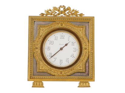 19TH C FRENCH 8 DAYS BRONZE AND ENAMEL TABLE CLOCK: A 19th century French 8 Days gold patinated bronze and enamel table clock. A white enameled dial with black Arabic numerals. The body of the clock is adorned with engraved floral, foliage, foliate scr