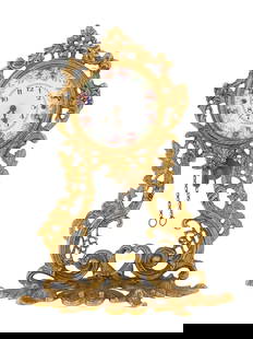 GERMAN 1 DAY MOVEMENT GOLD PATINATED BRONZE CLOCK: A German 1 Day Movement gold patinated bronze clock. A body is made in a relief design representing floral, foliage and foliate scroll motifs, adorned with pierced through accents. A white enameled di