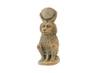 ANCIENT EGYPTIAN PTOLEMAIC FAIENCE BABOON FIGURINE: An Ancient Egyptian faience figurine of a baboon with Sun disc above his head and visible phallus. Ptolemaic Egypt, ca. 305 to 30 BC. In ancient Egypt, monkeys, particularly baboons, held significant