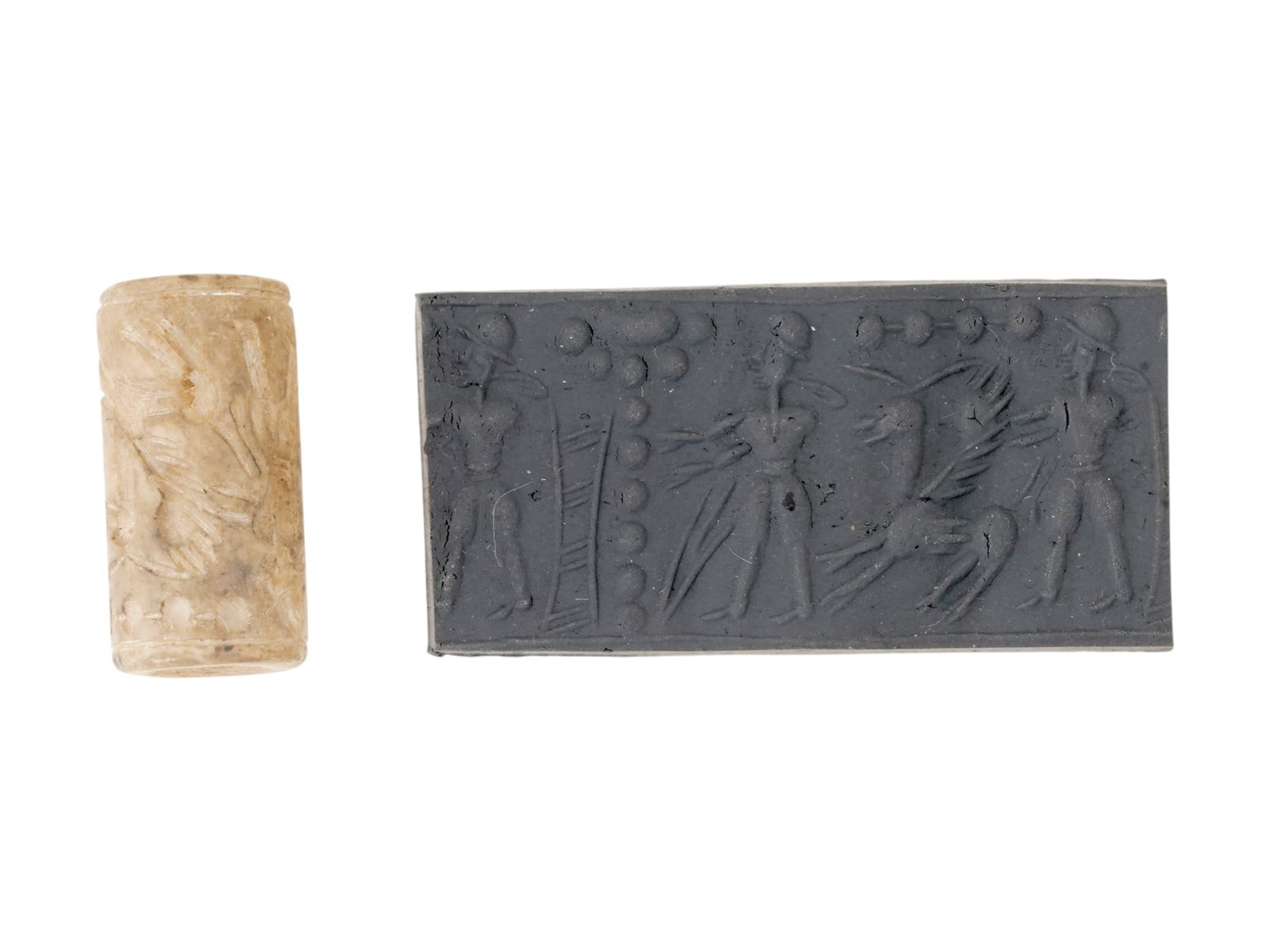 ANCIENT SYRIAN STONE CYLINDER SEAL BEAD: An ancient Syrian hand-carved stone cylinder seal bead. Ca. 1000 BC. The stamp depicts standing figures and a winged animal. Archaeological Finds And Relics, Ancient History, Middle East, Seals And St