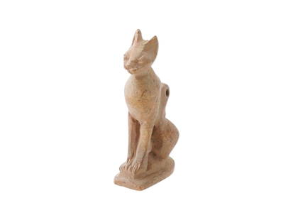 ANCIENT EGYPTIAN PTOLEMAIC CARVED LIMESTONE CAT AMULET: An ancient Egyptian cat amulet carved from limestone, dating to the Ptolemaic Period, circa 305 to 30 BC. Symbolizing the protective goddess Bastet and the sun god Ra, this amulet reflects the dual as
