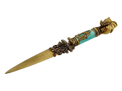 RUSSIAN GILT SILVER ENAMEL WITH DIAMONDS LETTER OPENER: A Russian enamel, gilt silver with diamonds letter opener. The letter opener is adorned with a turquoise blue guluoche enamel overlaid with a gilt silver foliage decor. Adorned with a figurative finia