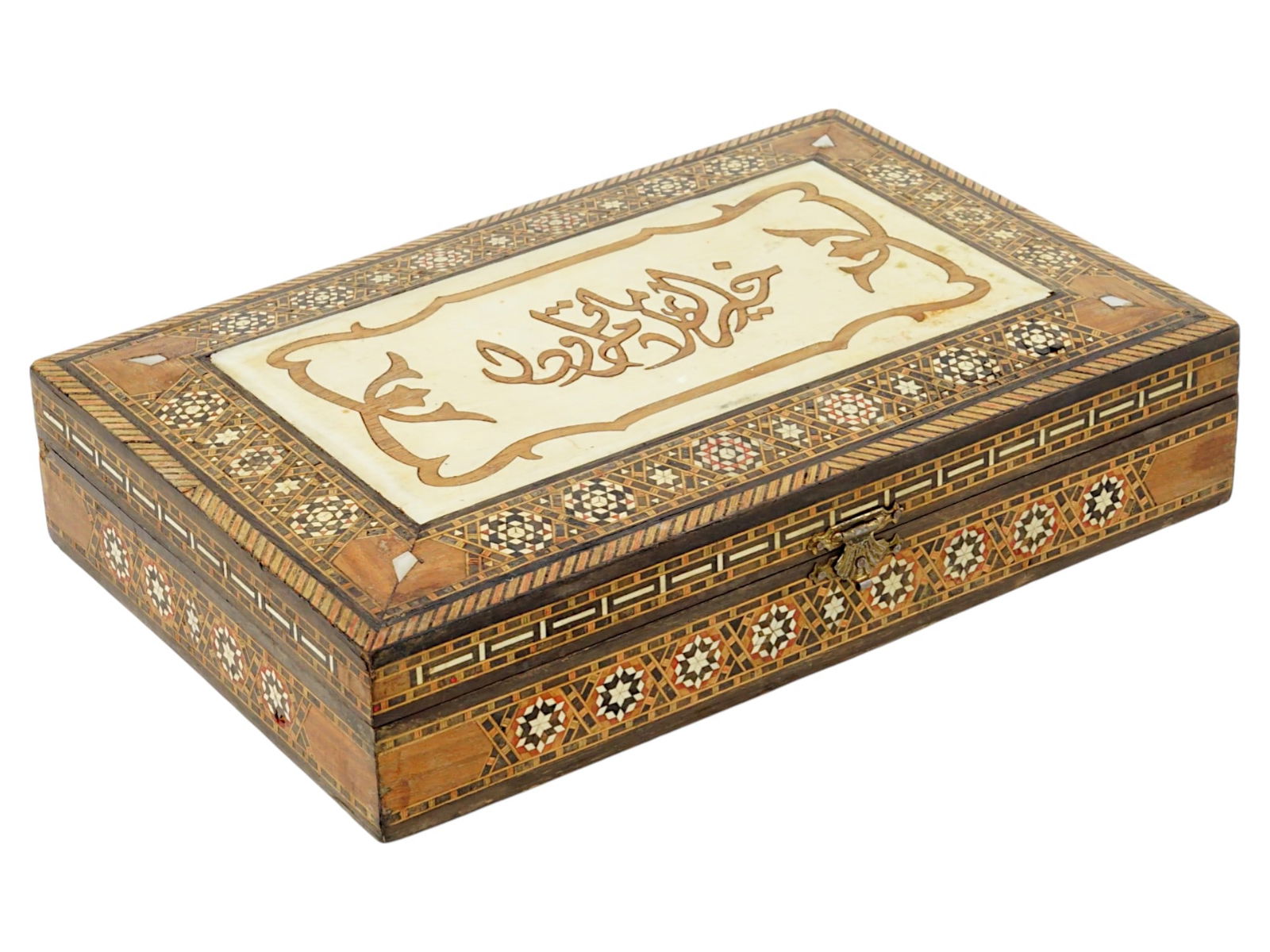 VINTAGE PERSIAN WOODEN MARQUETRY TRINKET BOX: A vintage Persian wooden marquetry trinket box. Circa the second half of the 20th century. The rectangular surface is skillfully inlaid with fine Sadeli mosaic motifs composed of various wood-type pie