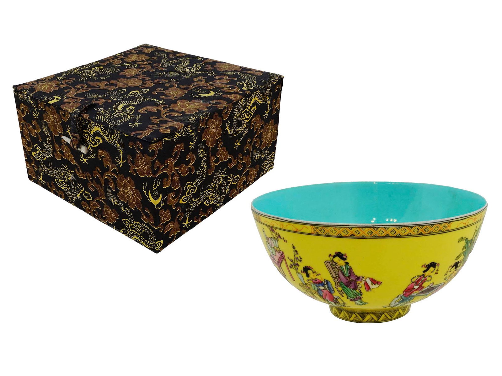 ANTIQUE CHINESE QIANLONG PORCELAIN BOWL: An antique Chinese yellow ground porcelain footed bowl. Circa Qing dynasty. Decorated with hand-painted genre scenes and ornaments. Turquoise interior. Underglaze blue Qianlong reign seal mark on the 