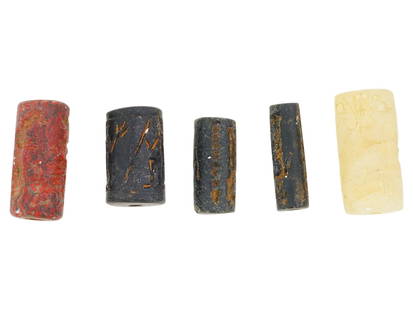 COLLECTION OF CYLINDER FORM CARVED STONE SEALS: A lot of five ancient manner cylinder form carved stone seals in various sizes. The imprints depict mythological human and animal figures. Cylinder seals were widely used in the ancient Near East as a