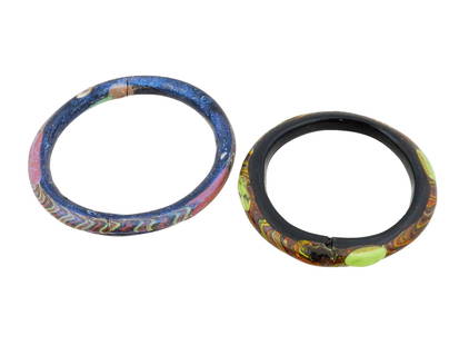 TWO ANCIENT ROMAN MULTICOLORED GLASS BRACELETS: A lot of two ancient Roman multicolored glass bracelets. The bracelets, with their vibrant hues, showcase the artistry of Roman glassmakers. Ancient Roman Jewelry And Glassware Collectibles. TH