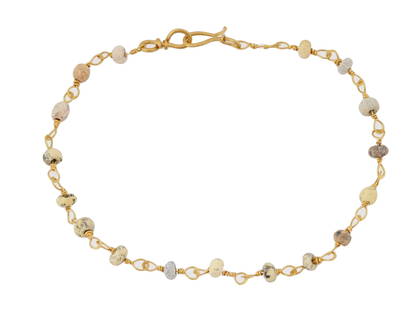 ANCIENT ROMAN GOLD AND GLASS BEAD BRACELET 100 TO 300AD: An ancient Roman bracelet crafted from a combination of double glass beads and gold loops. Circa 100 to 300 AD. The bracelet features intricately designed double glass beads, interspersed with elegant