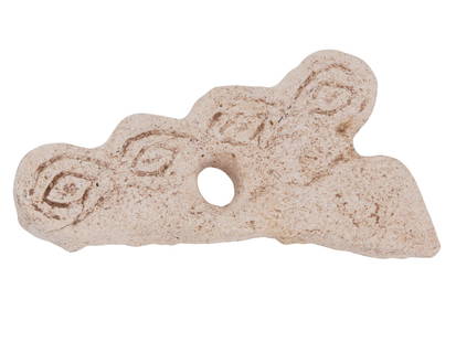 ANCIENT MESOPOTAMIAN CARVED DOUBLE EYE IDOL FRAGMENT: An ancient Mesopotamian carved sandstone double eye idol fragment, dating from 3000 to 2000 BC. Displays a portion of a stylized figure with flat bodies and prominent, simplified features. The heads a