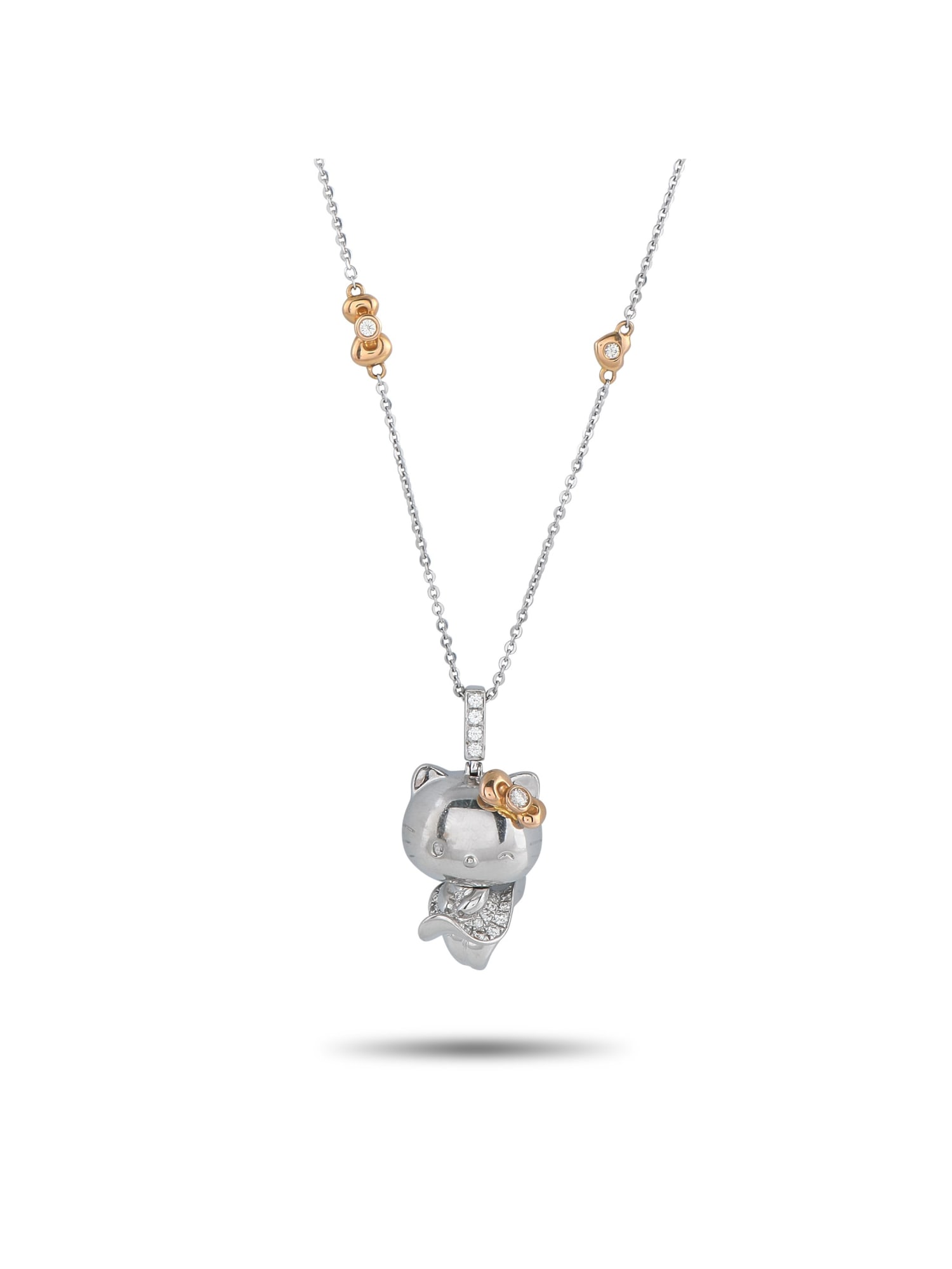 SANRIO HELLO KITTY 18K GOLD 0.57CT DIAMOND PENDANT NECKLACE: The Sanrio brands most iconic character makes a statement on this exquisite 18K White Gold necklace. Charming and elegant, the Hello Kitty pendant measures 1.25 long by 0.75 wide and is suspended from