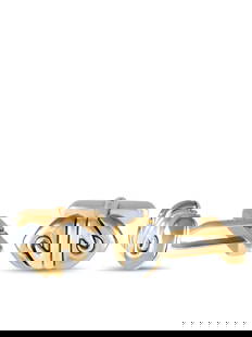 Bvlgari Doppio Cuore 18K Yellow Gold Hematite Cufflinks: Take your man's style game up a notch with this pair of yellow gold cufflinks embellished with a metallic grey gemstone. The Bvlgario Doppio Cuore cufflinks feature hematite ends that complement the y