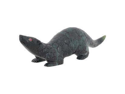 RUSSIAN CARVED RUBY GOLD BLACK JADE ARMADILLO FIGURE: A Russian hand carved black Jade figurine. The figurine depicts an armadillo, engraved with detailed patterns. The figurine is encrusted with Ruby stone eyes in gold settings. Russian Carved Stone Fig