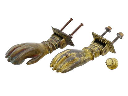 PAIR OF ANTIQUE 19TH C BRONZE HAND DOOR KNOCKERS: A pair of antique 19th-century gilt bronze hand-shaped door knockers. The lot also features a classic door knob. Hand door knockers are considered to have originated in Muslim countries and symbolise