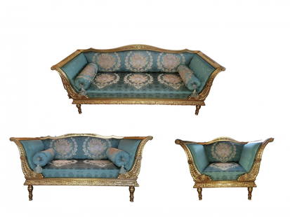 TWO ANTIQUE VICTORIAN GILTWOOD SOFAS WITH A CHAIR: A large antique Victorian giltwood sofa set of three pieces, featuring two sofas and a chair. The giltwood, intricately carved and gilded, adds a touch of regality and craftsmanship to the set. The co