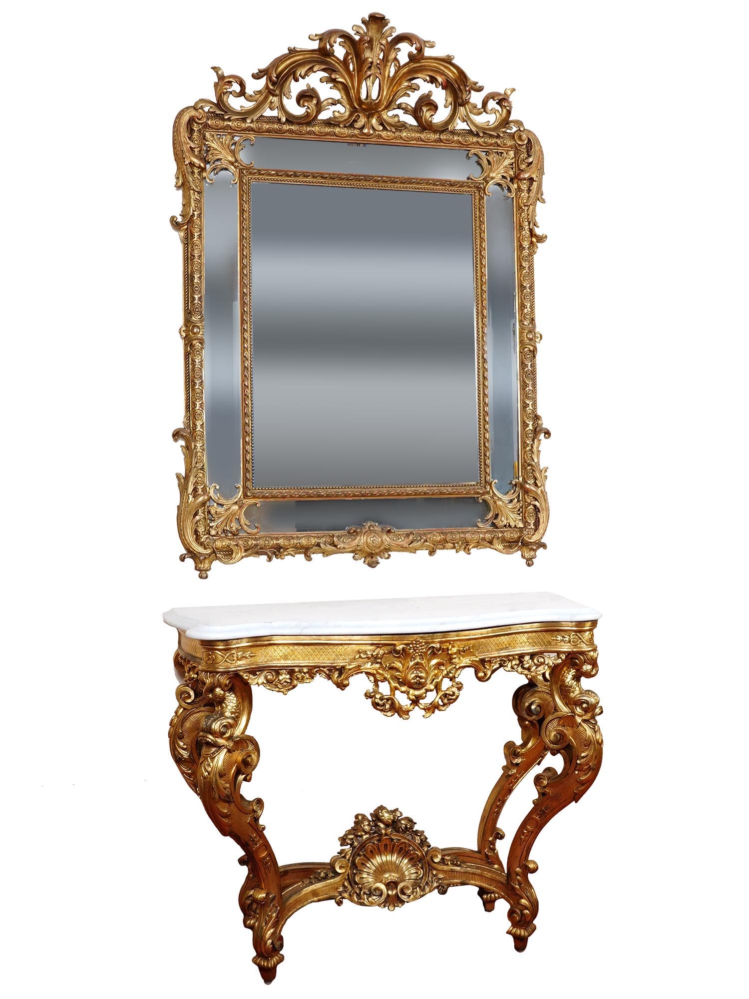 ANTIQUE LOUIS XVI GILTWOOD TABLE AND BRONZE MIRROR: An antique Louis XVI style console table exudes opulence with its exquisite craftsmanship and ornate details. The serpentine white marble top adds a touch of elegance to the piece and provides a funct