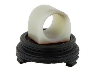 CHINESE WHITE HETIAN JADE RING WITH RED ON STAND