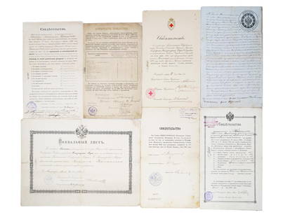 GROUP OF 7 ANTIQUE OFFICIAL RUSSIAN DOCUMENTS: A group of 7 antique official Russian documents of the early 20th century. Partially filled by hand. Among the documents, there are several certificates of conferring the title with grades, a certific