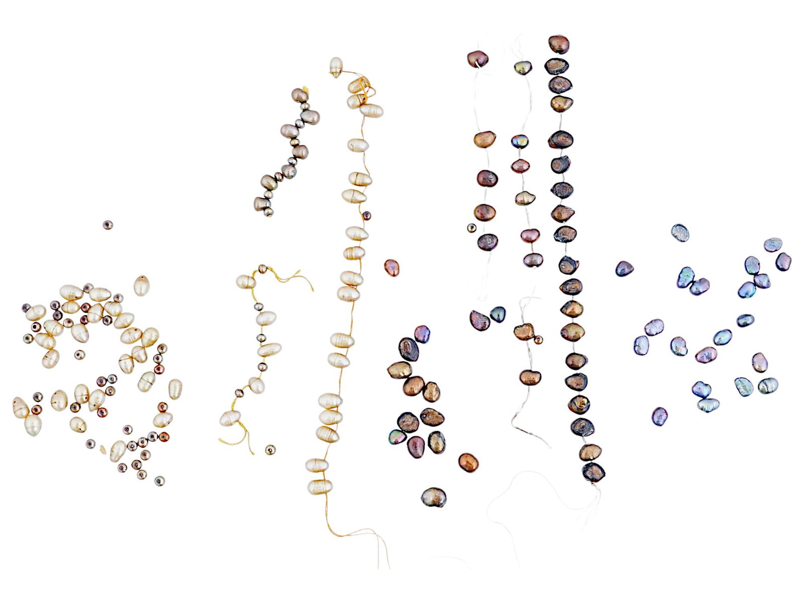 COLLECTION OF VARIETY MULTICOLOR BAROQUE PEARLS: A collection of a variety of multicolor baroque pearls arranged in separate clusters and strands. Some loose and some loosely strung together. Natural Pearls And Classical Jewelry Collectibles.