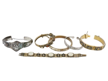 GROUP OF SIX VINTAGE SILVER AND BRASS BRACELETS