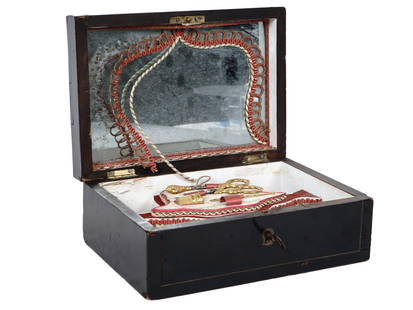 ANTIQUE SEWING TOOLS KIT IN ORIGINAL WOODEN CASE: An antique late 19th - early 20th century sewing tools kit. A total of six items including a pair of scissors, a thimble, two thread spools, an awl, and a threading needle. Each item has a golden orna