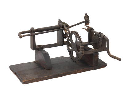 ANTIQUE VICTORIAN ERA KITCHEN TOOL APPLE PEELER: An antique Victorian era kitchen tool, an apple peeler. Circa mid to late 19th century. The tool features a hand-held mechanism with a pitchfork on which apples were impaled, after which the handle wa