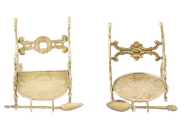 PAIR OF ORNATE BRASS CUP HOLDERS WITH SPOONS