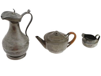 ANTIQUE ENGLISH ARTS AND CRAFTS PEWTER TABLEWARE SET: A set of antique English Arts and Crafts hand hammered tableware pieces, circa 1900 - 1940. Includes a teapot and a creamer by Samuel Groves and Co, each piece is marked on the bottom: Roundhead Leadl