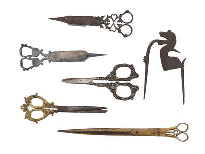 ANTIQUE CANDLE WICK SCISSORS AND BETEL NUTCRACKER: A lot of antique 18-19th century scissors. A total of six items, including two pairs of candle wick scissors with snuffer boxes and a cast iron horse-shaped betel nutcracker. All scissors have ornate