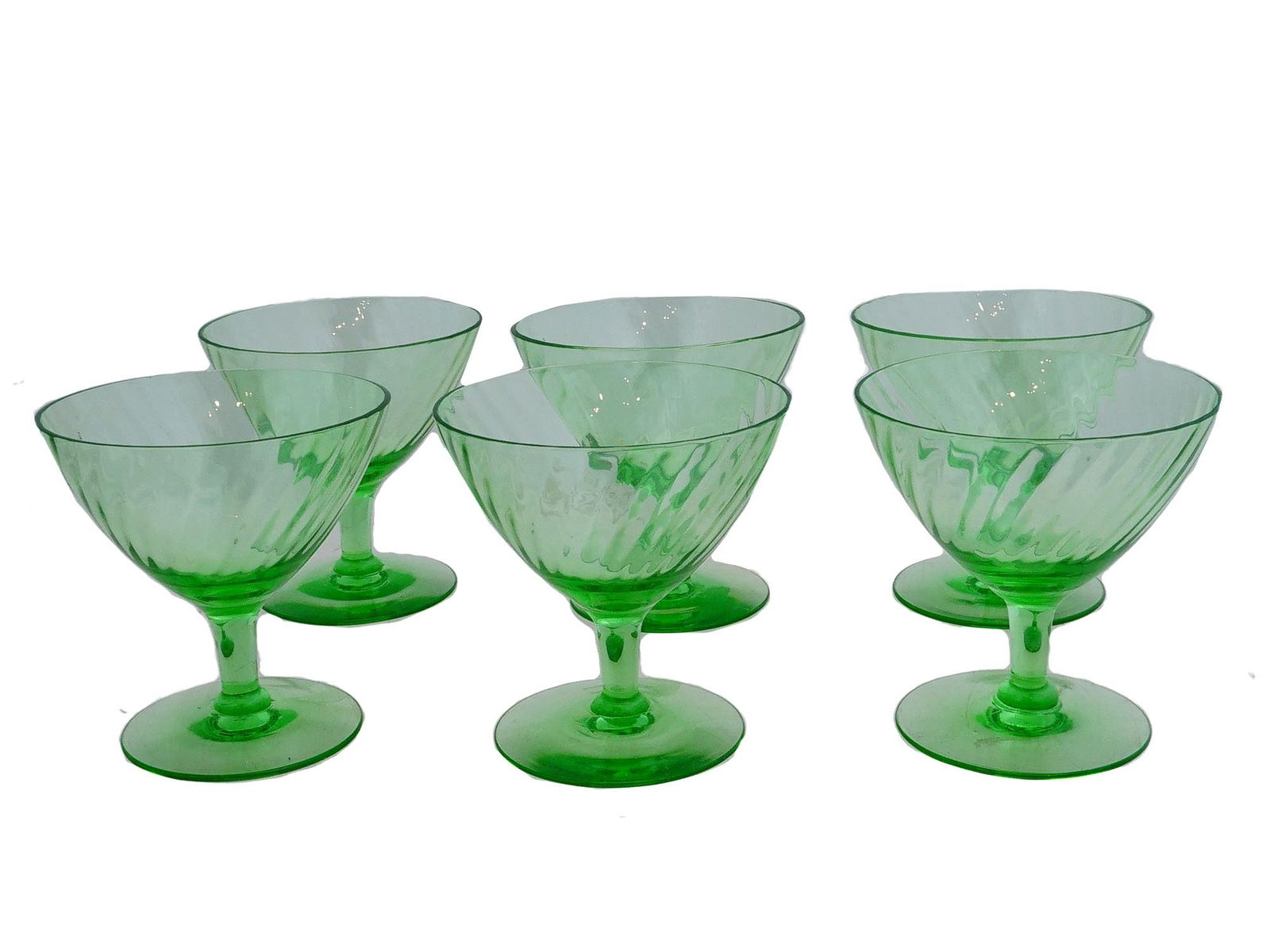 VINTAGE URANIUM GLASS COCKTAIL GLASSES SET: A set of six vintage cocktail glasses. Made of uranium glass, signature semi-transparent green color. Stemmed glasses with fluted bowls. Unmarked. Collectible Glassware And Barware. THIS LOT QU