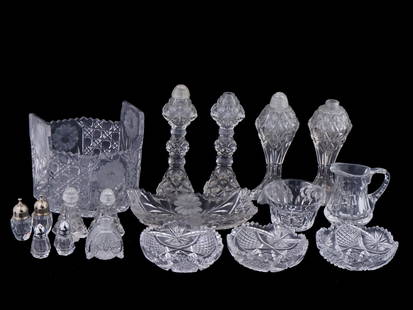 VINTAGE CUT CRYSTAL DINNERWARE AND SALT SHAKERS: A lot of vintage cut crystal tableware. A total of 18 items, including 5 pairs of salt and pepper shakers, an individual salt shaker, a fruit bowl, a candy dish, 3 serving bowls, a serving plate, and