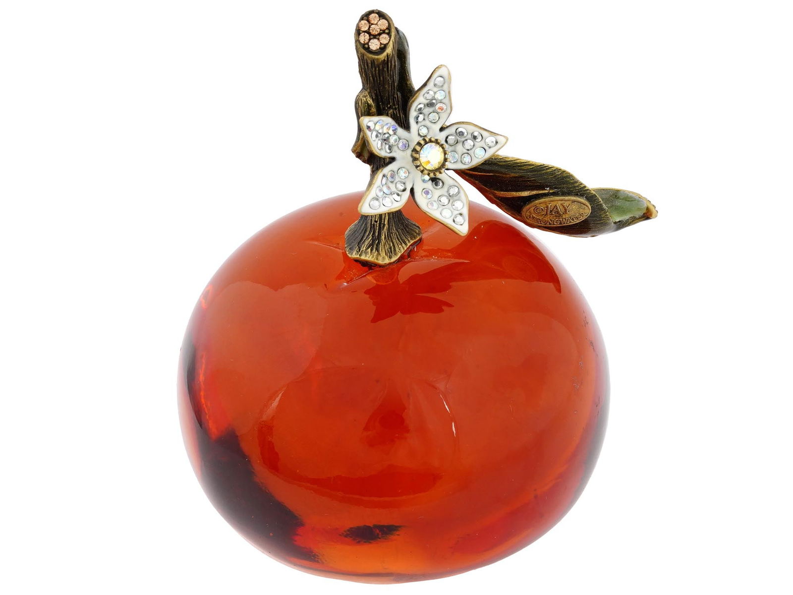 CRYSTAL CLEMENTINE PAPERWEIGHT BY JAY STRONGWATER: An orange crystal clementine fruit paperweight from the Flora and Fauna collection. With enameled leaves and blossom, hand set with iridescent Swarovski crystals. Jay Strongwater logo is located under