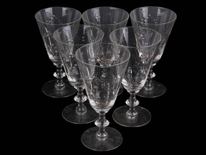 COLLECTION OF SIX VINTAGE CUT GLASS DRINK WARES: A collection of six vintage clear glass drink wares. The footed glasses are adorned with design in a cut glass foliage pattern. Unmarked. Antique and Vintage Glass Table and Drink Ware and Collectible