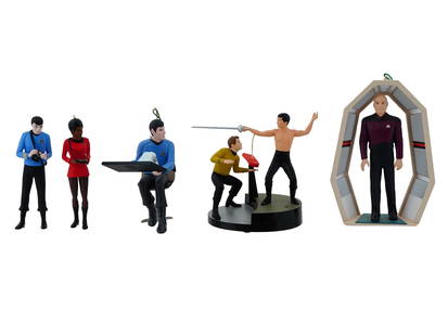GROUP OF HALLMARK KEEPSAKE STAR TREK ORNAMENTS: A collection of five Hallmark Keepsake Star Trek ornaments, celebrating iconic characters and moments from the legendary sci-fi franchise. The lot includes the 2018 Star Trek ornament, the 1995 Captai
