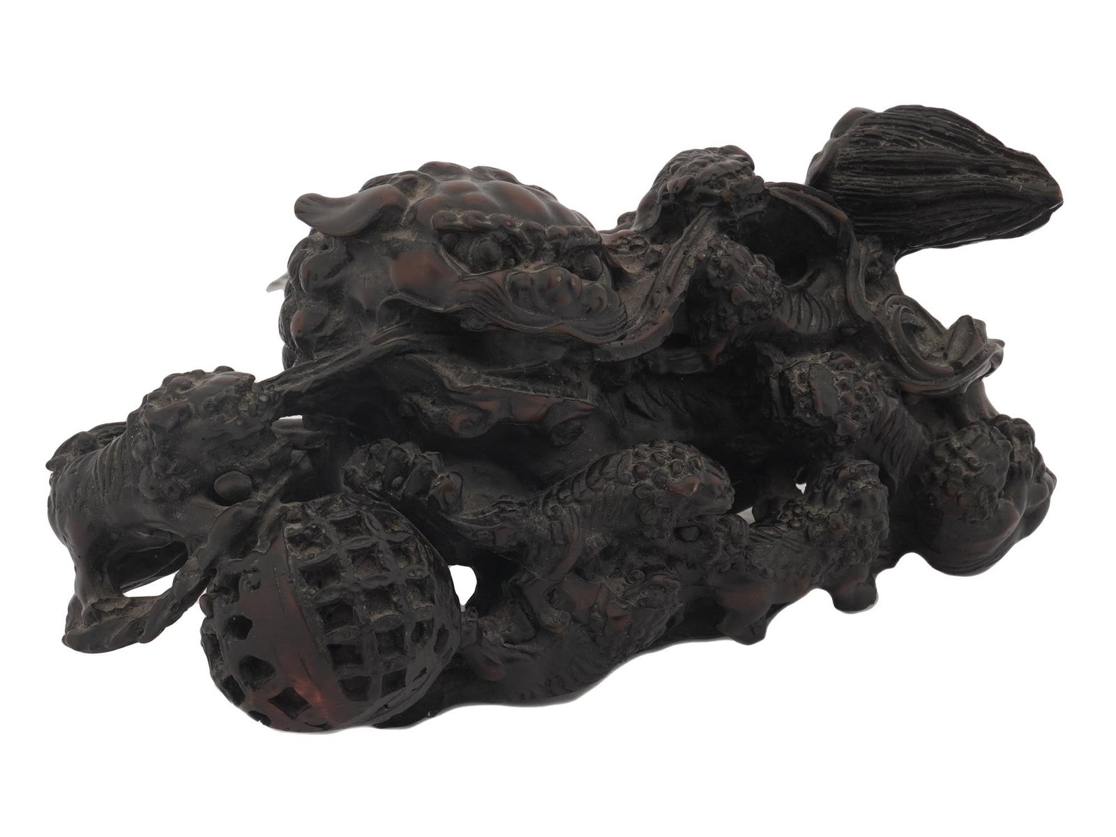 ANTIQUE CHINESE GUARDIAN LION DOG WITH PUPS: A figurine representing a Chinese imperial guardian lion, also known as a foo dog. The highly stylized lions are a traditional Chinese architectural ornament. The figurine represents a male lion with 