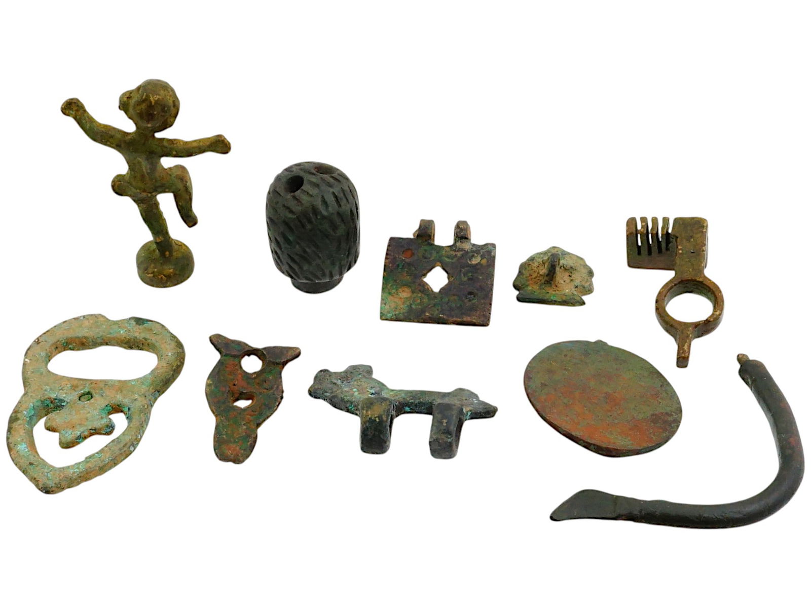 COLLECTION OF ANCIENT ROMAN BRONZE ARTIFACTS: A collection of ancient Roman bronze artifacts. The artifacts are varied, showing a mix of functional and decorative objects. They include a small dancing figurine. The collection includes other fragm