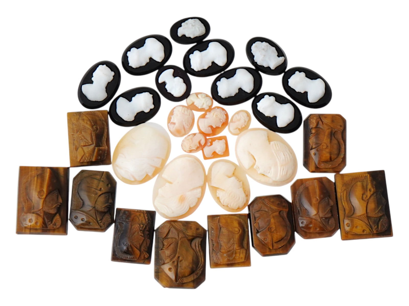 COLLECTION OF ANTIQUE HAND CARVED CAMEOS: A collection of antique hand carved cameos, dating to the late 19th to early 20th century. A total of 30 items. Each piece is crafted from conch shell and stone, featuring knights in armor and female