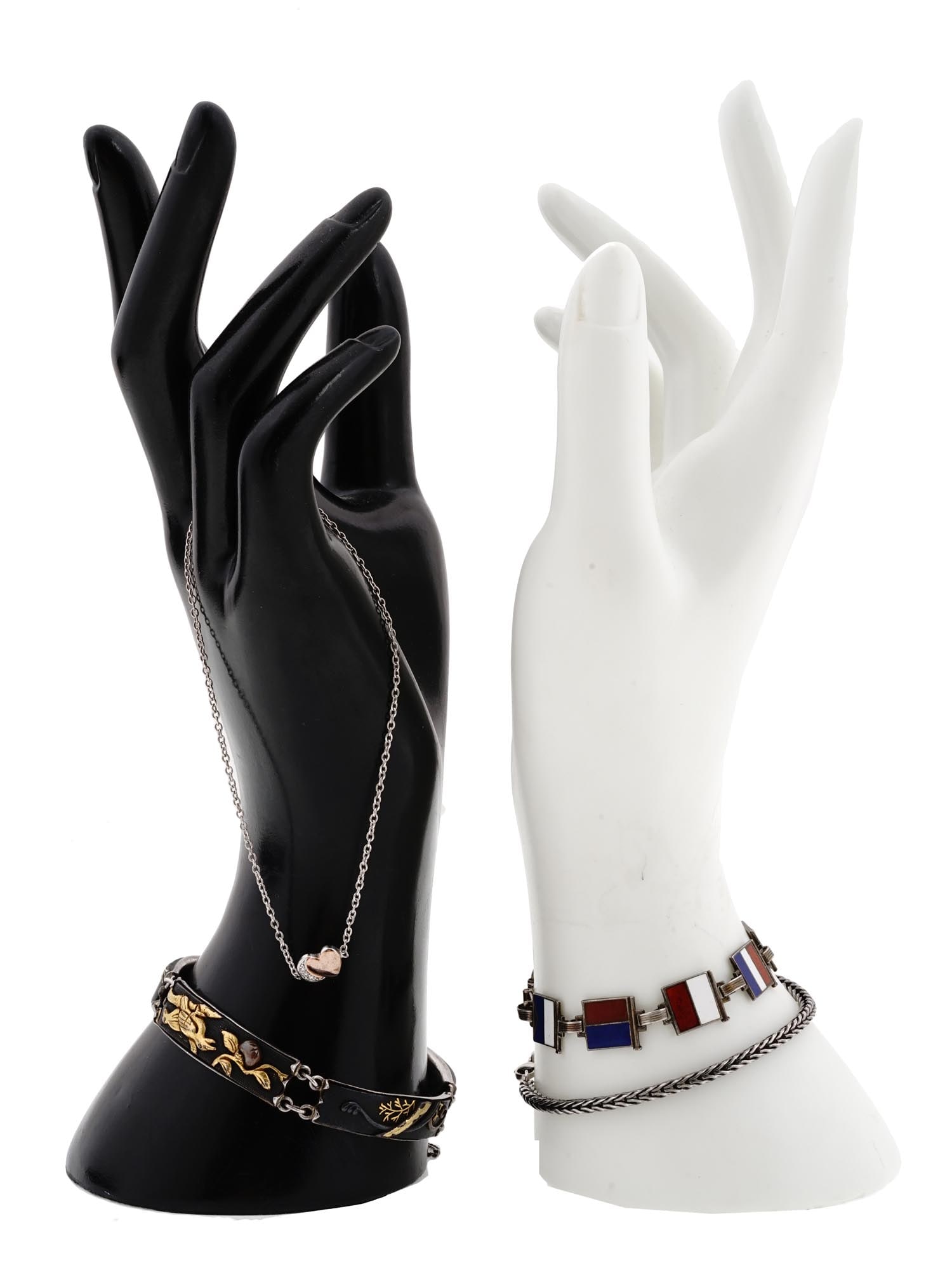 VINTAGE STERLING SILVER CHAIN AND LINK BRACELETS: A lot of vintage sterling silver bracelets. Palma chain bracelet, marked 925 on the clasp. Slider chain bracelet with a heart charm, marked Lacm 925 on the fastener. A bangle bracelet composed of four