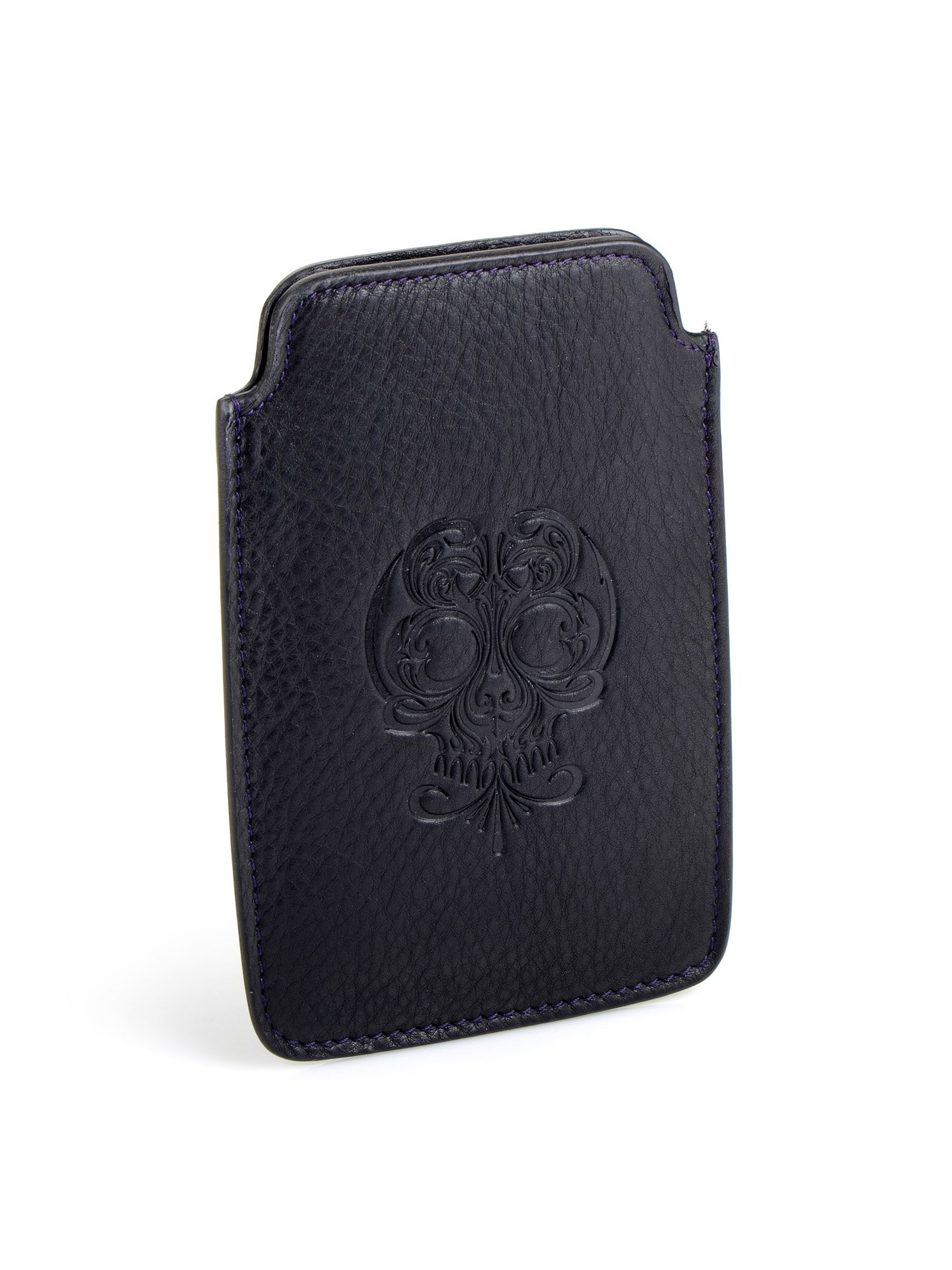 Stephen Webster Black Calfskin Leather iPhone Case: Understated yet undeniably Rock 'n Roll, this decorative skull engraved black leather iPhone case is a stunning phone protector and style accessory that is proudly engraved with the Stephen Webster na