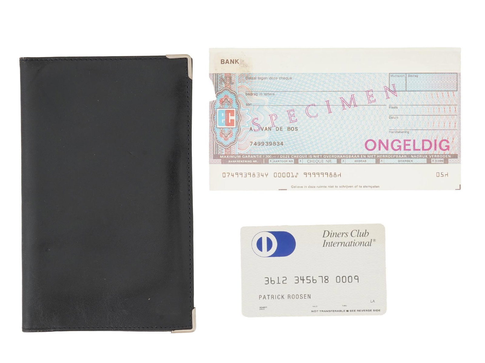VINTAGE ITALIAN BLACK LEATHER BILLFOLD: A vintage Italian leather billfold. Vertical wallet with multiple card slots. The lot also feature a Dutch paycheque and Diners Club International cards. Vintage Leather Goods And Accessories.